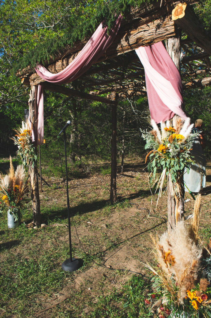 fresh flowers tied in front of the pergola